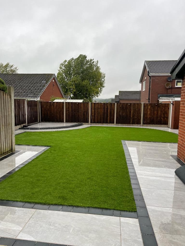 Finished garden with a new lawn in a small enclosed space