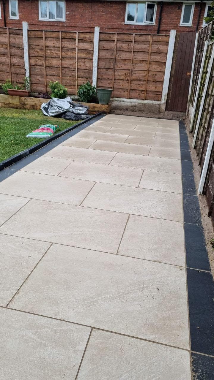Porcelain paved patio with wide joints and a level finish
