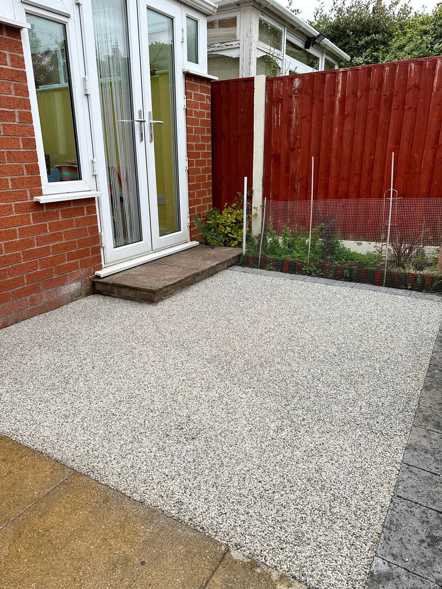 Resin bound surfacing laid up to a doorway